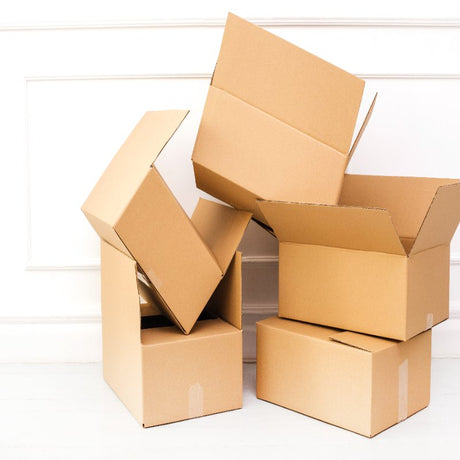 A pile of cardboard boxes on a white background.