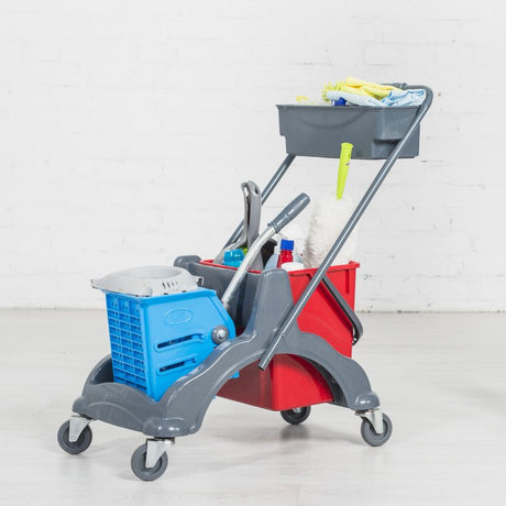 A cleaning cart with a bucket of cleaning supplies.